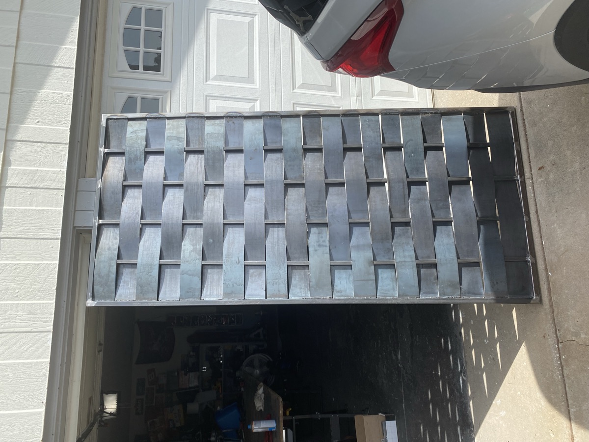 Woven steel panel — artisan fabrication
