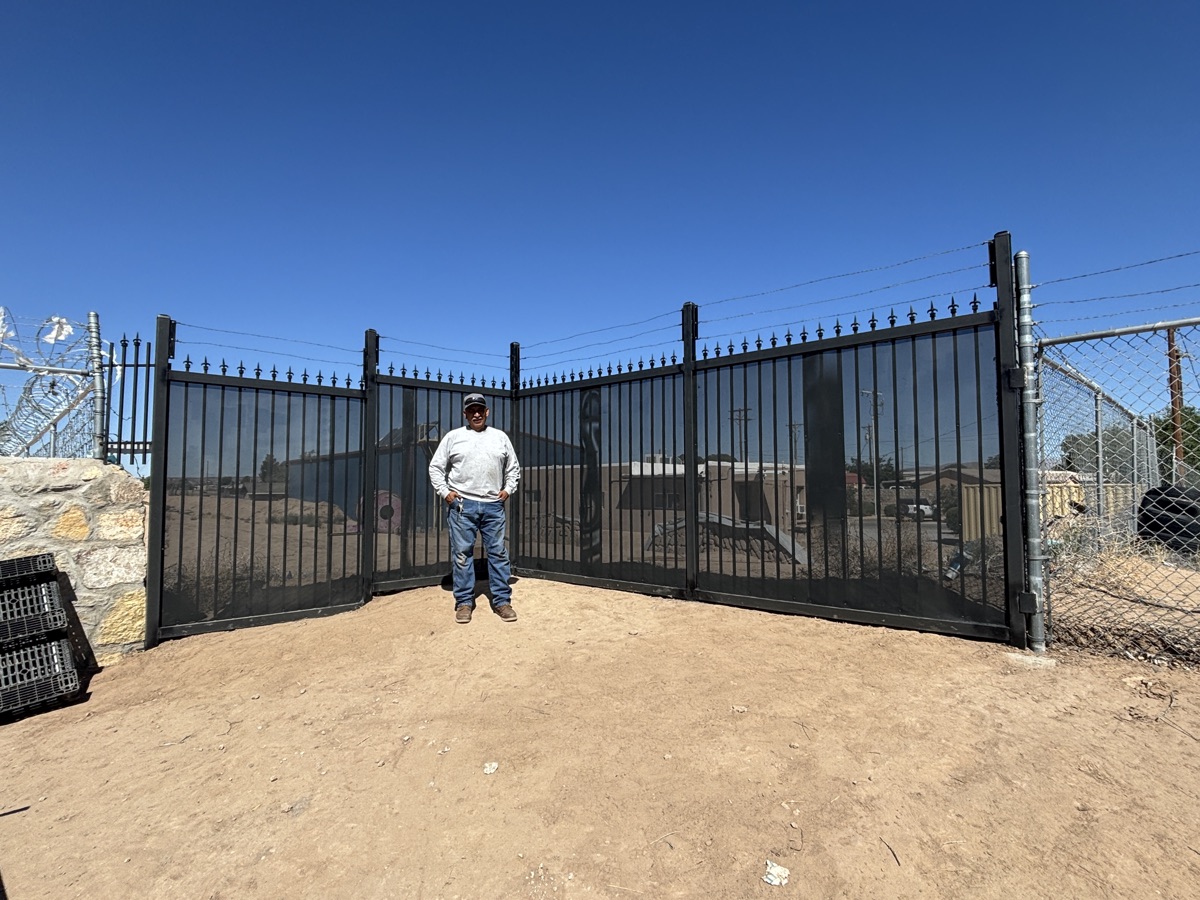 Sal with ornamental wrought-iron driveway gate